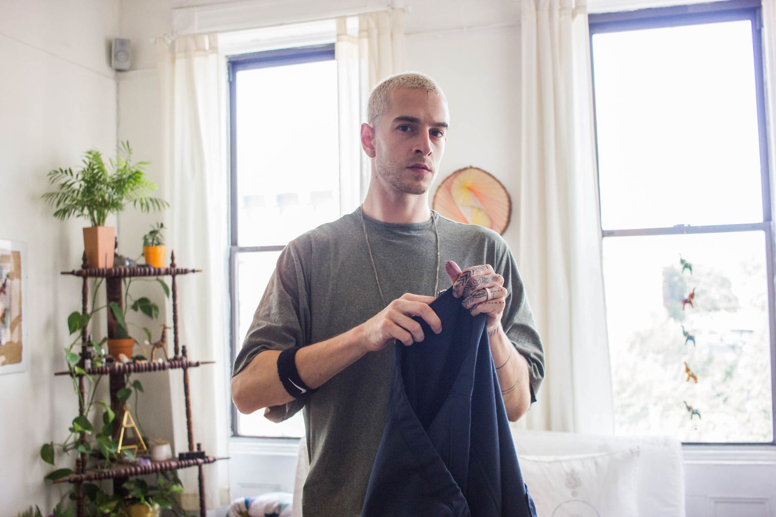 Lukas Van Der Fetch, known under his artists name as LVDF, working in his Brooklyn studio on his unique clothing line. LVDF designs many of the clothing and cos
