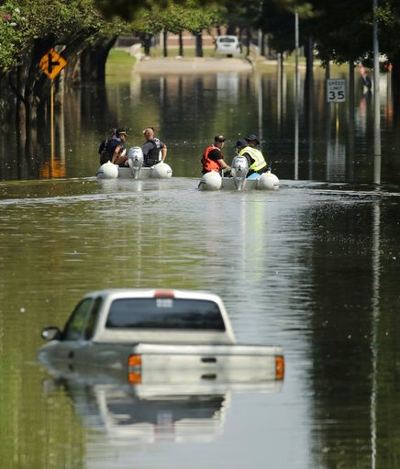 Sept. 2, 2017: Customs and Border Patrol boats look through a neighborhood which was flooded when the Barker Reservoir reached capacity in the aftermath of Hurr