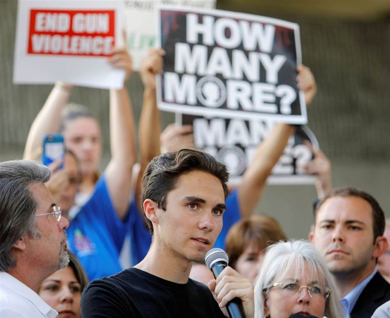 David Hogg, a senior at Marjory Stoneman Douglas High School, calls for more gun control at a rally in Fort Lauderdale on Saturday. Jonathan Drake / Reuters