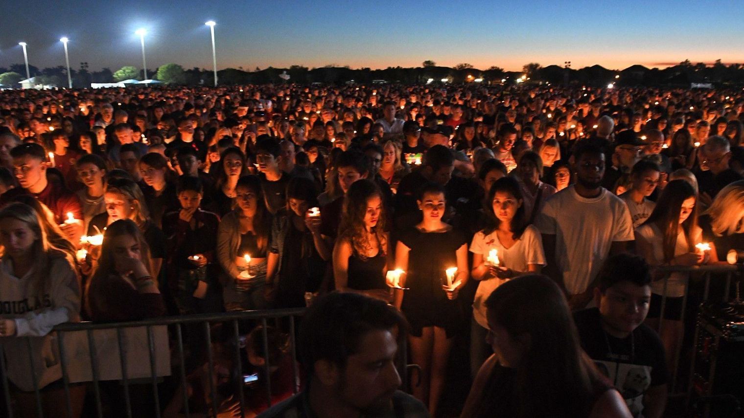 The crowd converged on a park for a candlelight vigil Thursday, where they hugged and cried via Sun Sentinel.