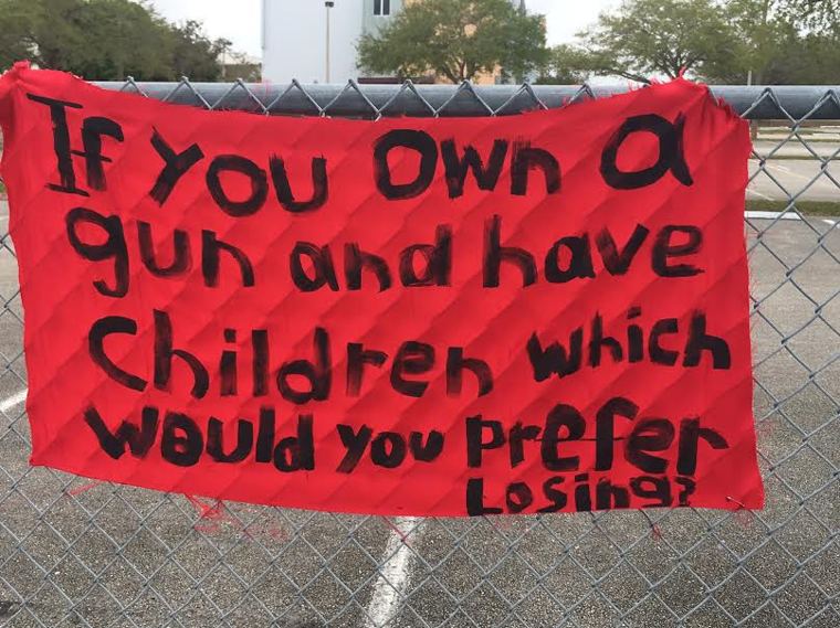 Sign that hands outside Marjory Stoneman Douglas High School via Maria Cuomo Cole.
